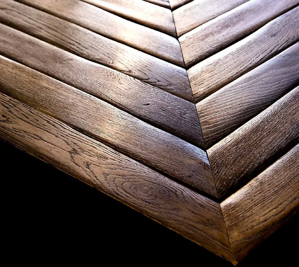 Dark oak chevron parquet with a hand-brushed finish